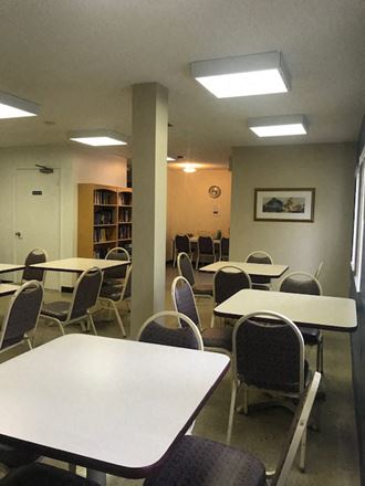 The-Oaks-Community1 Community room with tables and chairs for residents