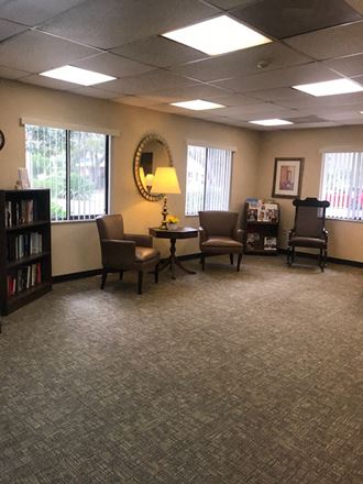 The-Oaks-Sitting2 sitting area with furnishings and decor beside windows