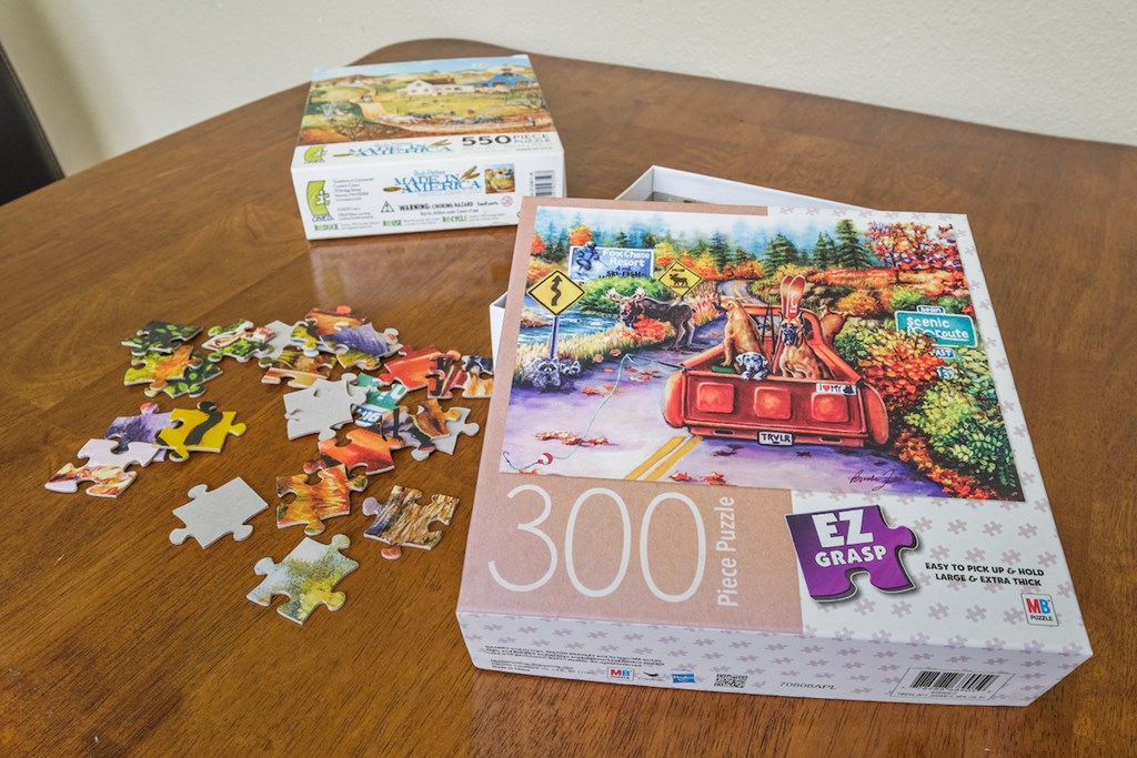 puzzles sitting on a table for residents to enjoy at Sundale Manor Senior Apartments