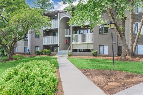our apartments have a spacious courtyard with green grass and trees