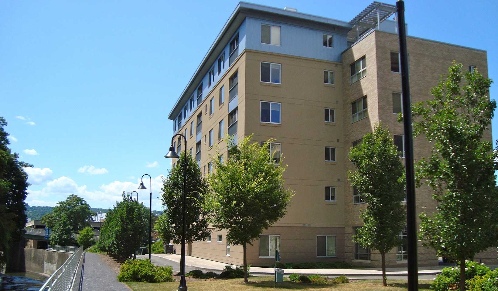a tall building with trees in front of it