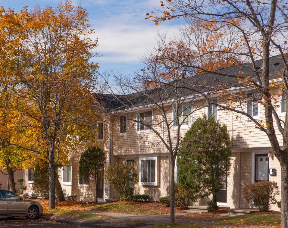 a house with a car parked in front of it