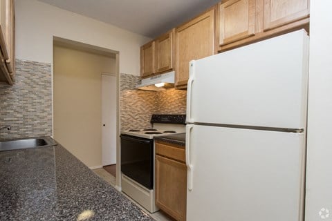our apartments offer a kitchen with a refrigerator and a stove