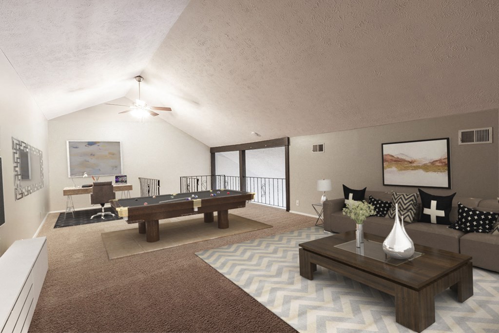 a large living room with a pool table and a couch