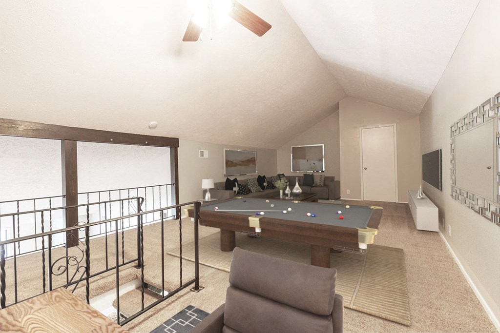 a pool table is in the center of a living room with a balcony