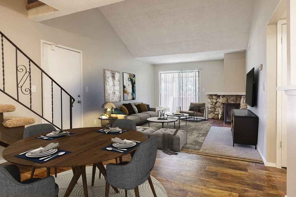 a living room with a dining room table and a couch