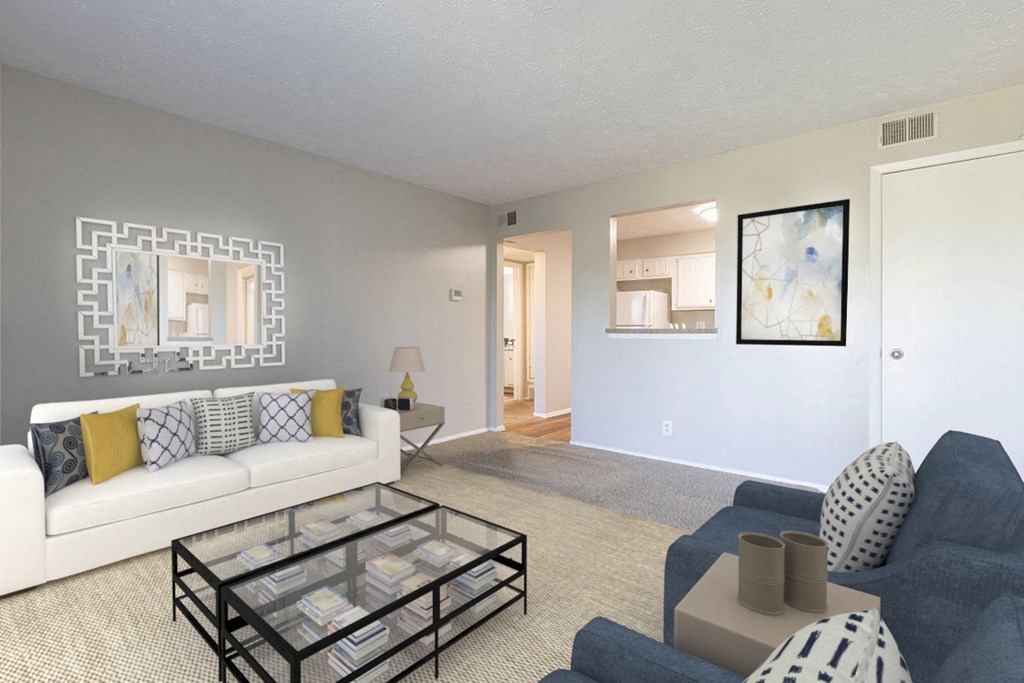 a living room with a white couch and a glass coffee table