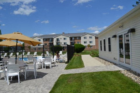 Somersworth NH Apartments For Rent Tara Meadows Apartments a backyard with tables and chairs and a pool