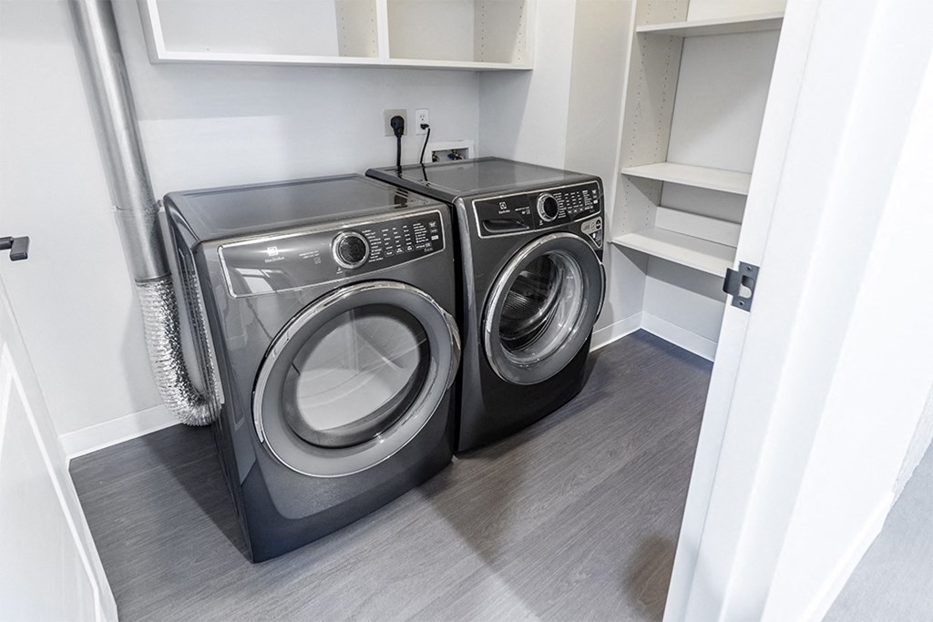 a small laundry room with a washing machine and a dryer