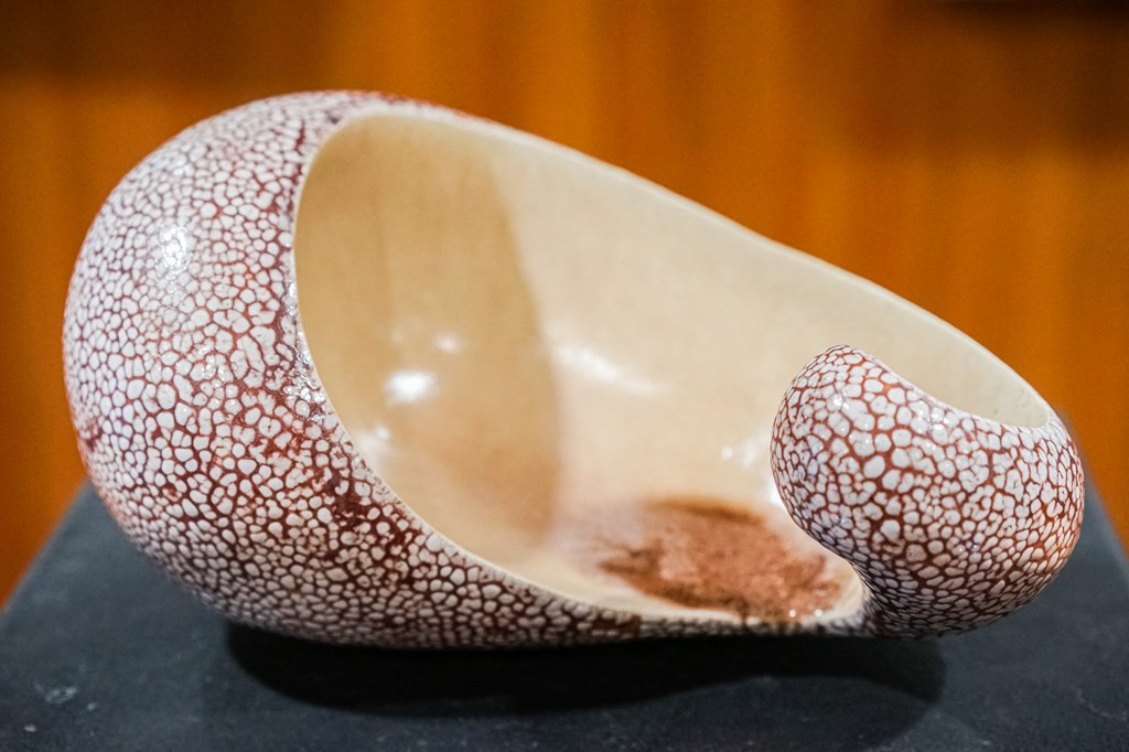 a bowl shaped like a nose on a table