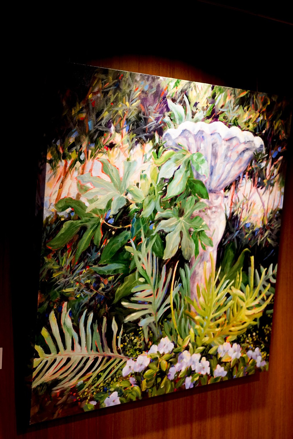 a painting of a woman standing in a garden