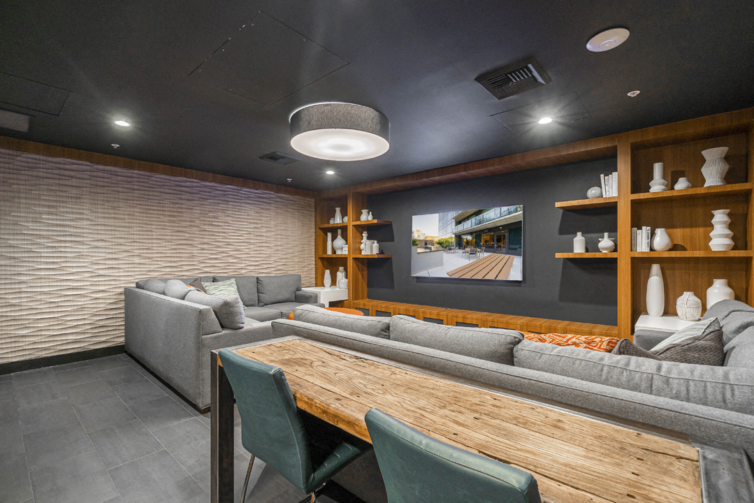 a living room with couches and a wooden table
