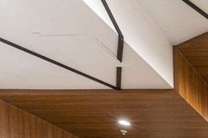 a rendering of a hotel lobby with a reception desk and couches