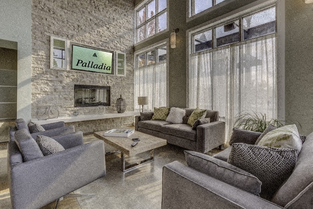 a living room with couches and chairs and a fireplace