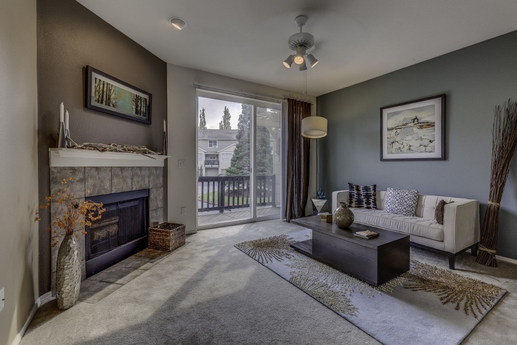 a living room with a fireplace and a couch