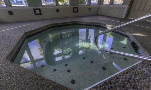 the inside of an indoor swimming pool with water in it