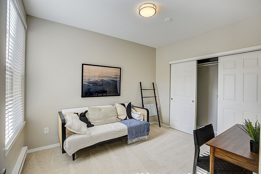 a living room with a couch and a table