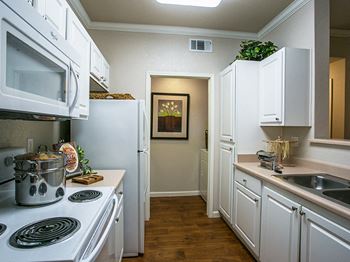 Full Model Kitchen with Dishwasher and Microwave at Apartment Homes near Travis Air Force Base