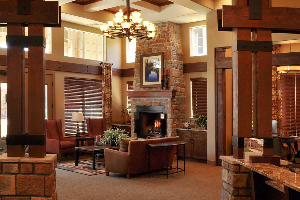 a large living room with a fireplace and furniture