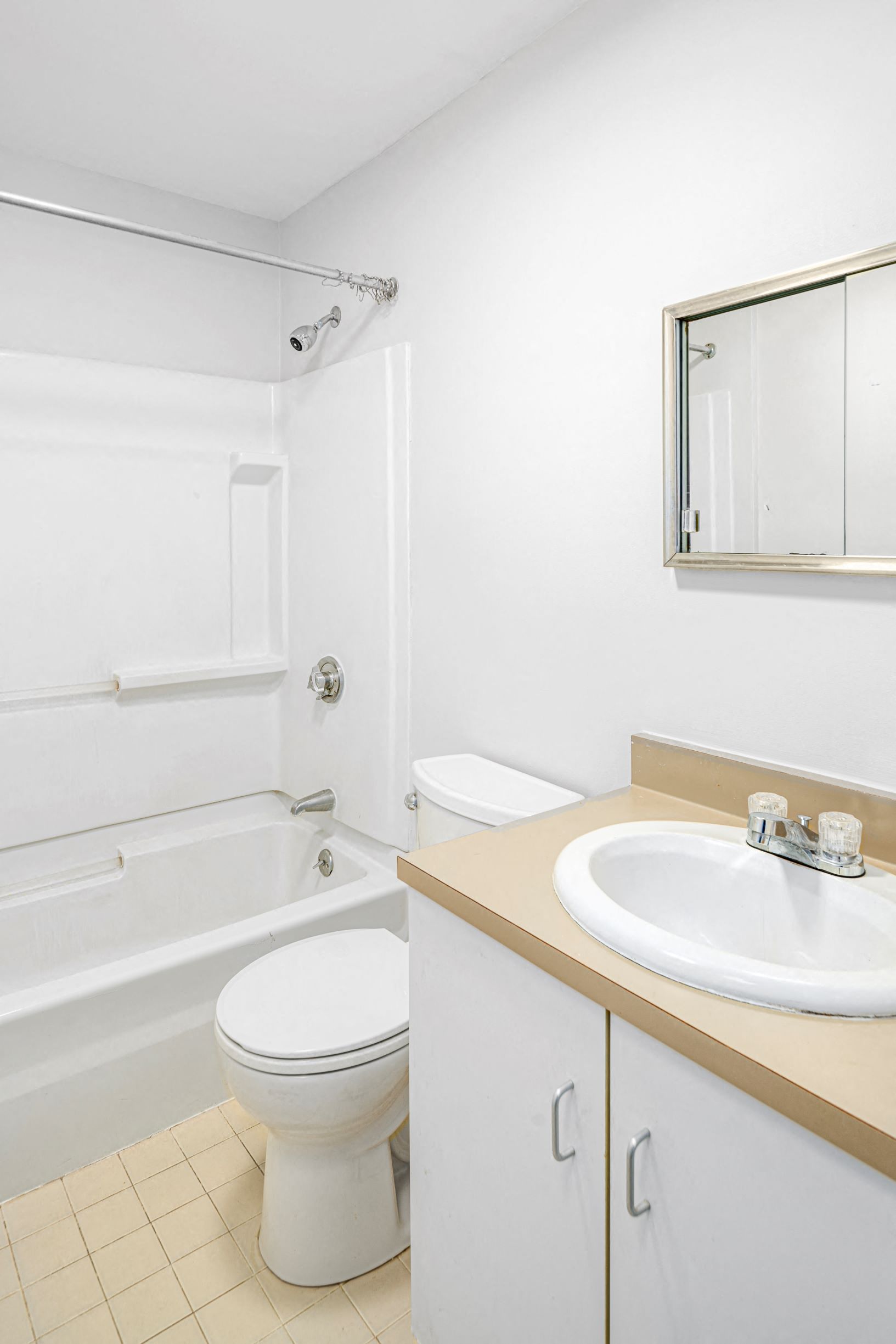 a bathroom with a sink toilet and a bath tub