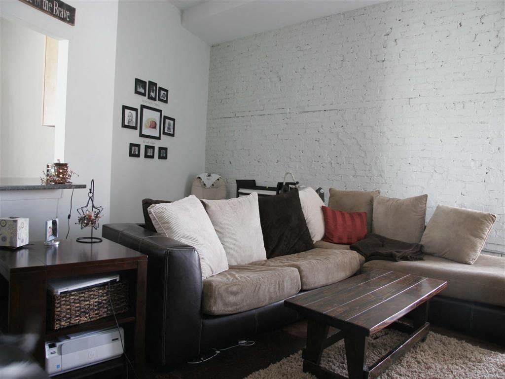 a living room with a couch and a table