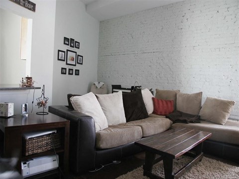 a living room with a couch and a table