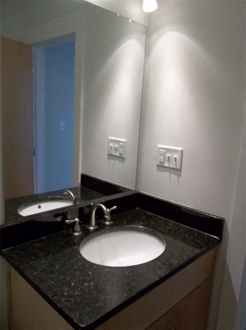 a bathroom with a sink and a mirror