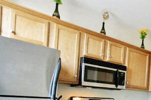 a kitchen with wooden cabinets and stainless steel appliances
