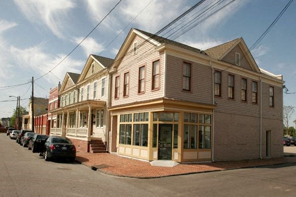 a row of houses on the side of a street