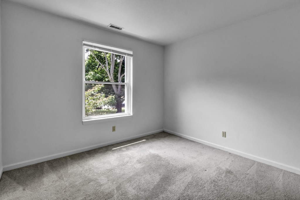 an empty room with a window in it