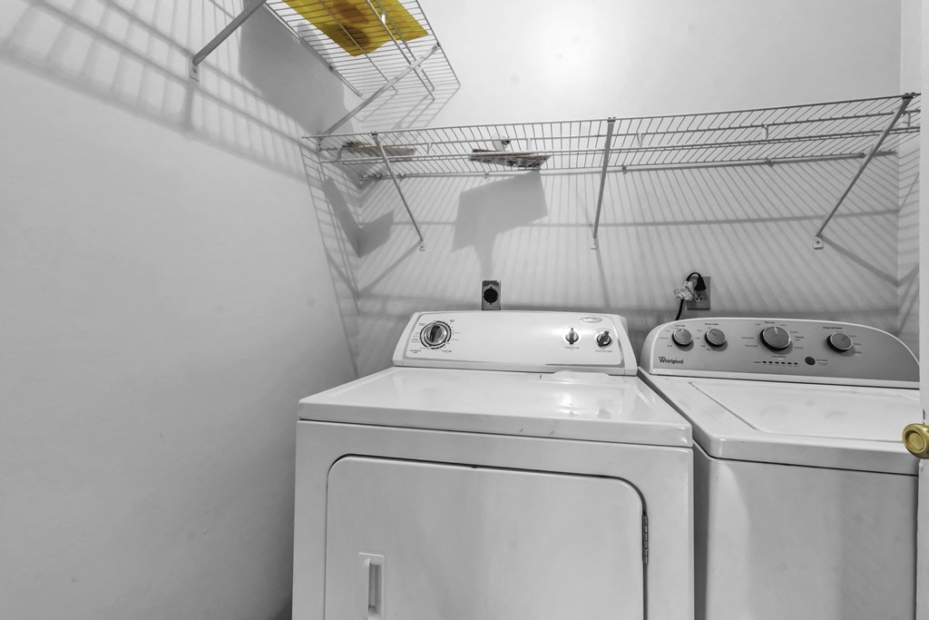 the laundry room has two washes and a dryer