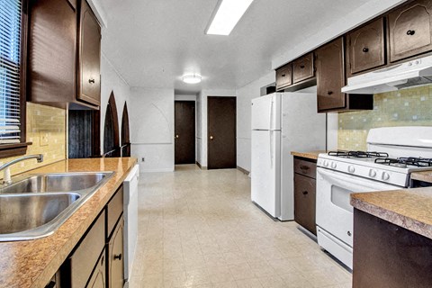 a kitchen with a stove and a sink