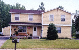 A two story house with a porch.