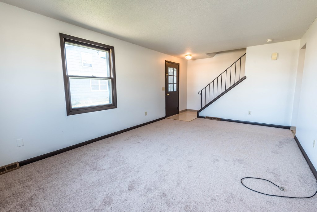 the living room is empty and ready for us to move in to our new home