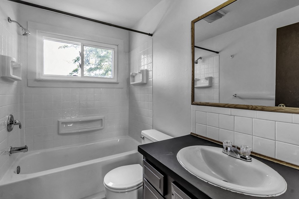 a bathroom with a sink and a bath tub
