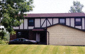 a house with a car parked in front of it