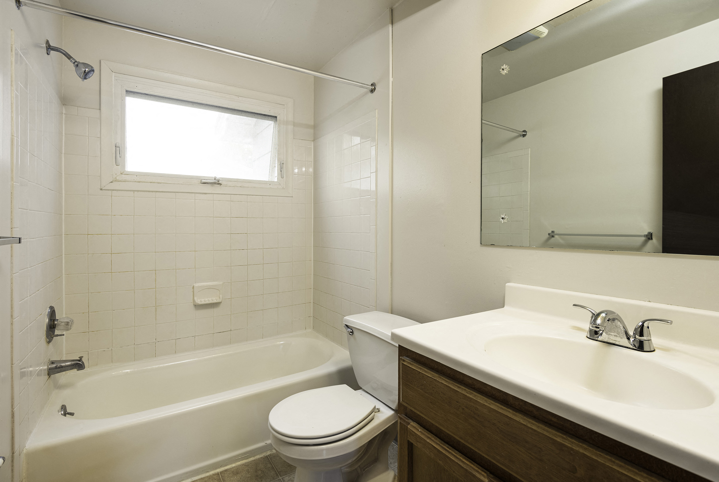a bathroom with a sink toilet and a bath tub