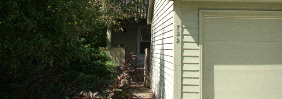 the side of a house with the door open