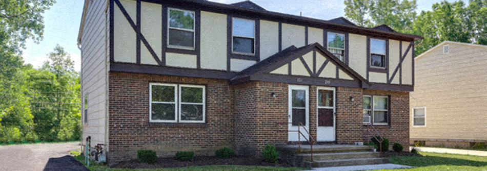 A house with a white door and windows.