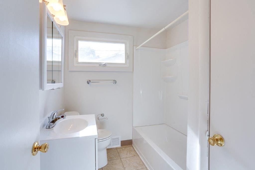 a bathroom with a sink toilet and a shower