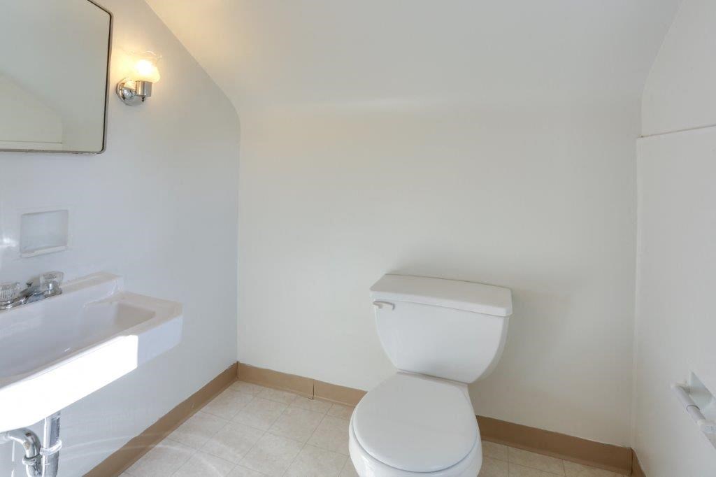 a bathroom with a toilet and a sink