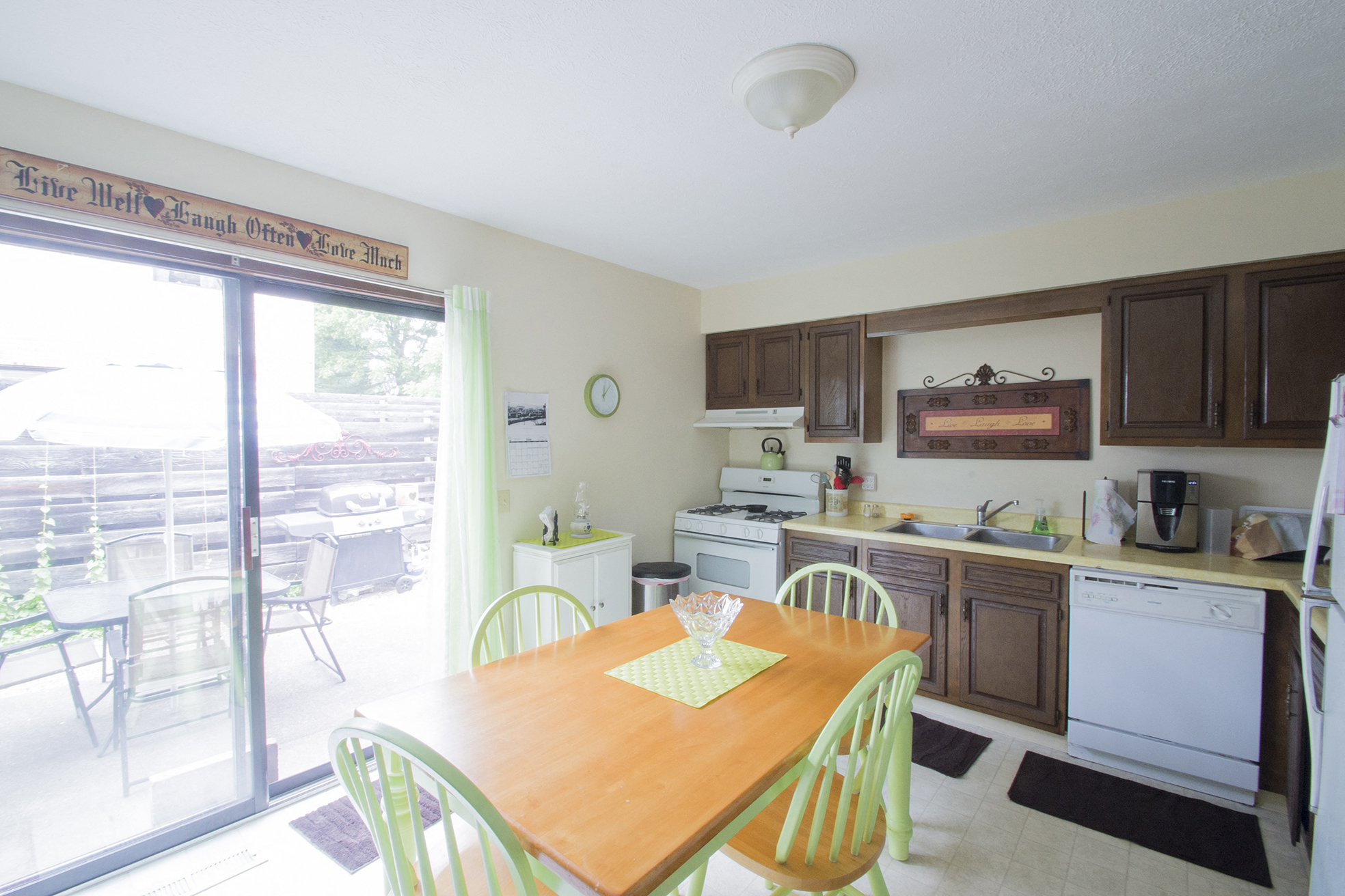 a kitchen with a dining table and a sliding glass door