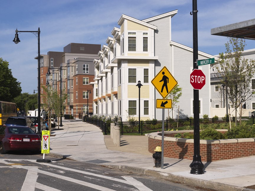 a street corner with a stop sign and a building