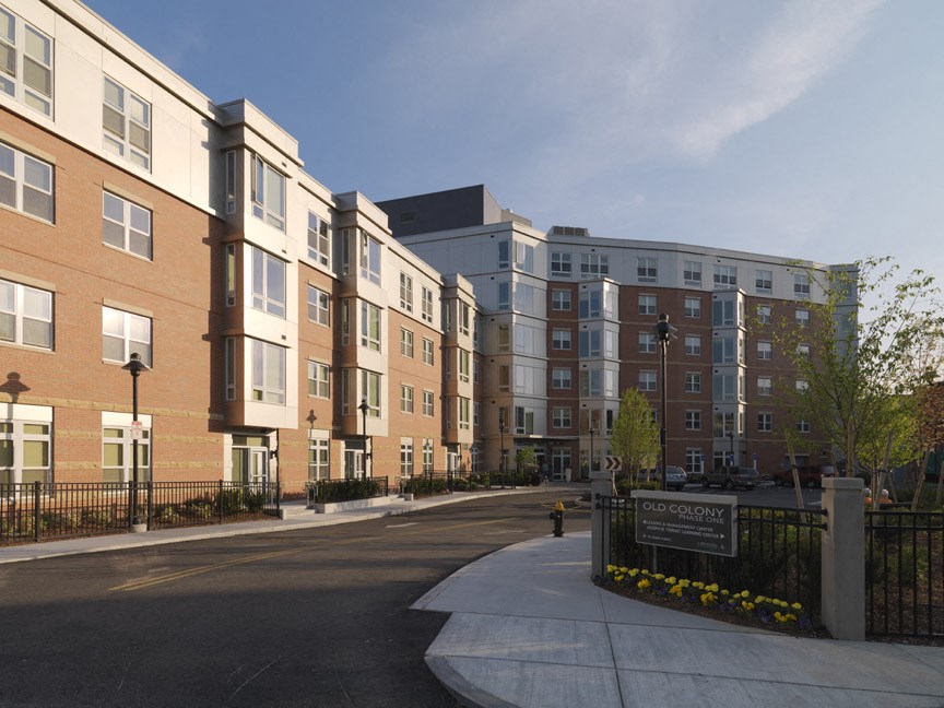 a view of a street in front of an apartment building