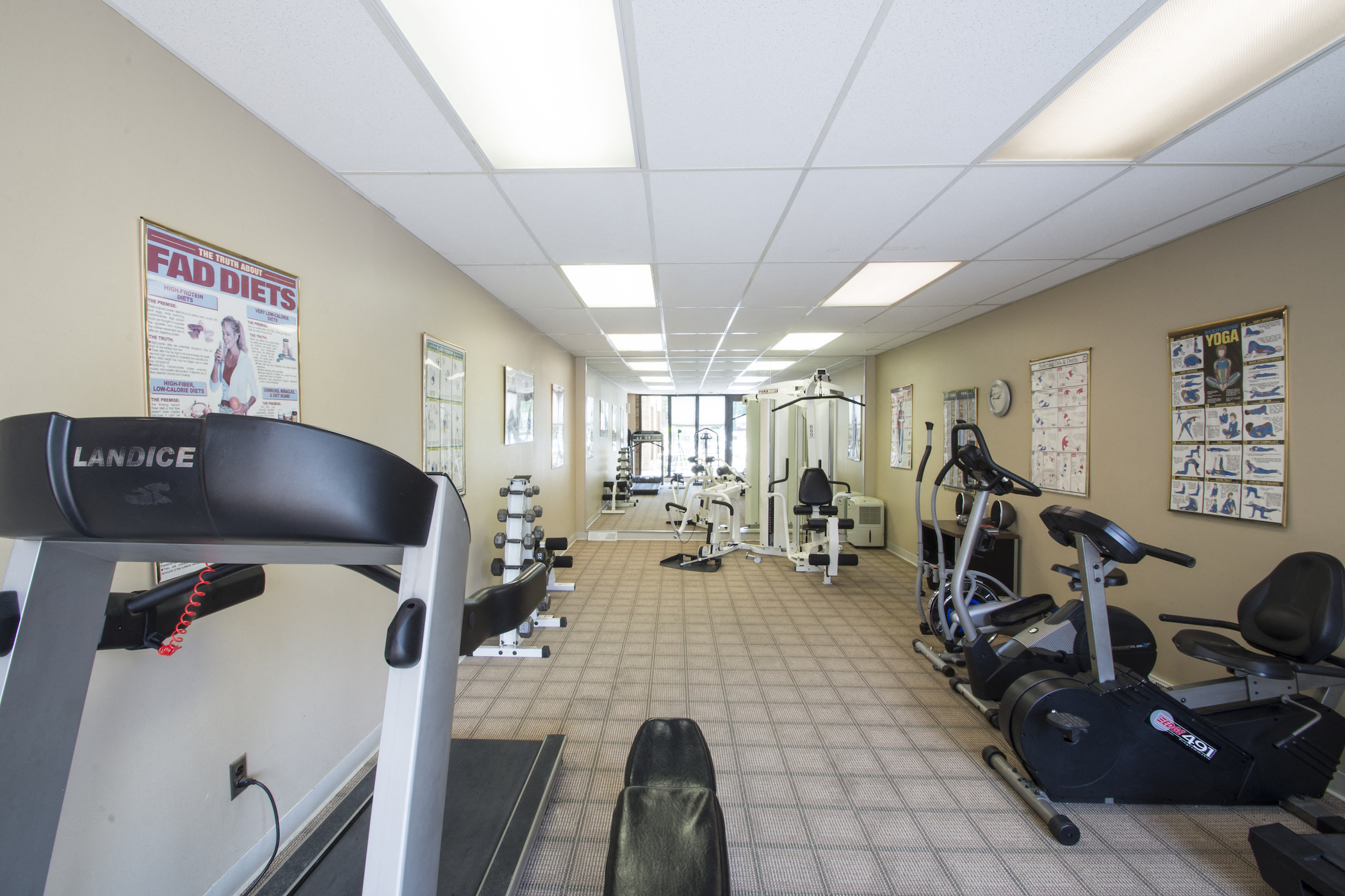 a gym with various exercise equipment at the gateway apartments tx