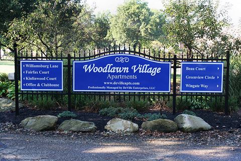 a sign for woodlawn village apartments