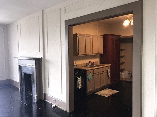 a view of a kitchen with a fireplace