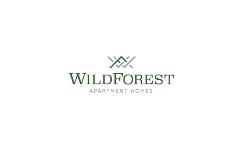 a logo of a wild forest apartment homes