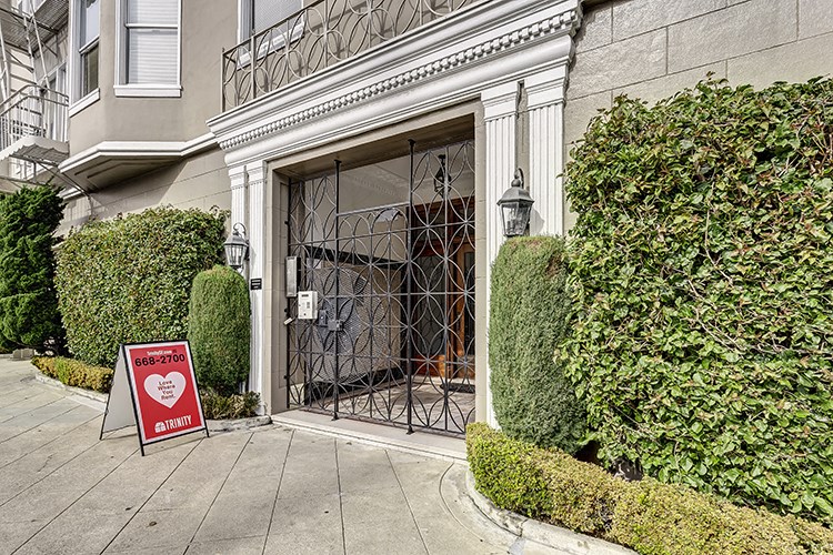 the front door of a building with a closed sign in front of it