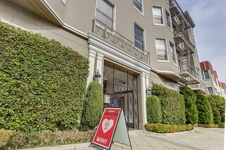 a sign in front of a building with a closed door